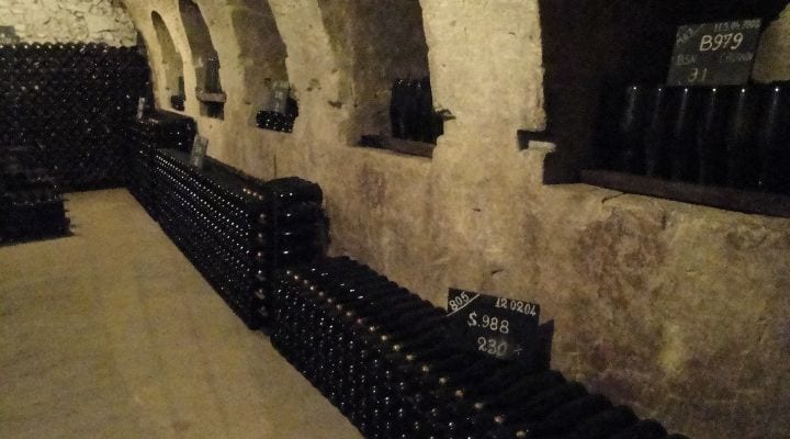 How many bottles are kept in the Champagne houses cellars?